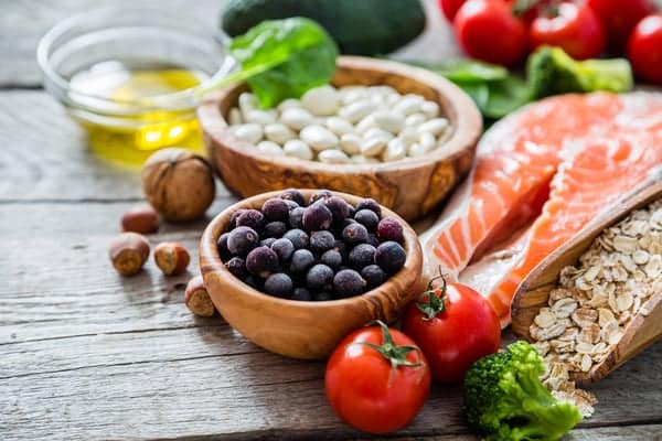 Functional nutrition foods, including salmon, beans, olive oil, nuts and tomato
