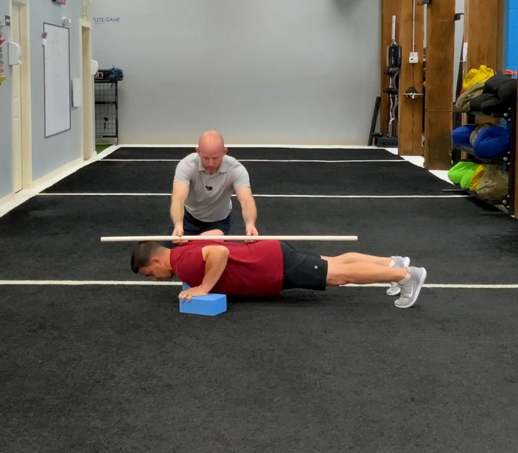 AFPA Principles of Exercise Programming Instructors Demonstrating an Extreme Push-Up Hold